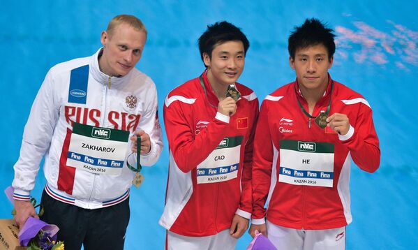 Илья Захаров (Россия) - 2-е место, Цао Юань (КНР) - 1-е место, Хэ Чао (КНР) - 3-е место (слева направо)